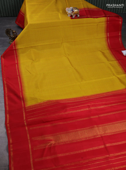 Pure kanchipuram silk saree yellow and red with allover small checked pattern and temple design rettapet zari woven border