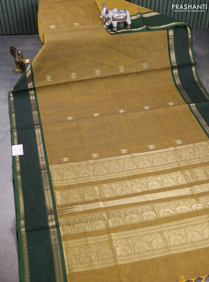 Kanchipuram silk cotton saree dark mustard and green with zari woven buttas and rettapet zari woven border