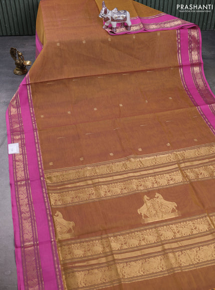 Kanchipuram silk cotton saree dark mustard and light pink with zari woven buttas and rettapet zari woven border