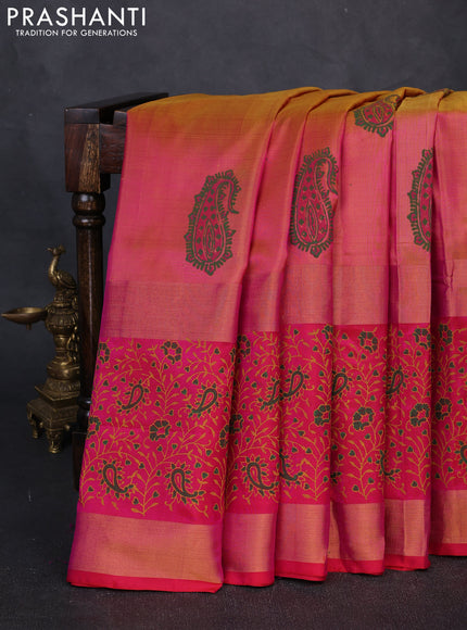 Pure uppada block printed silk saree dual tone pinkish yellow and pink with paisley butta prints and long zari woven printed border