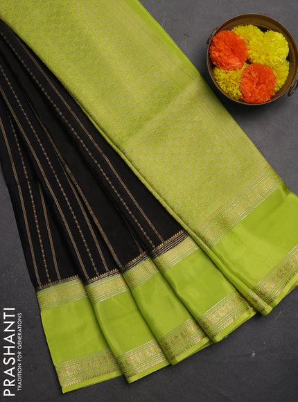 Semi mysore silk saree black and light green with allover zari weaves and rettapet zari woven border