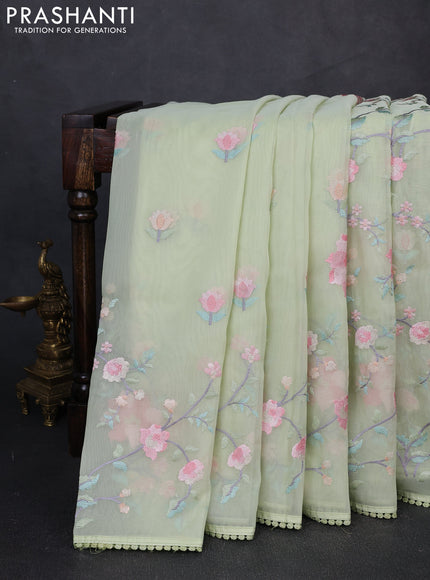 Organza saree pista green with floral embroidery work and crocia lace work border