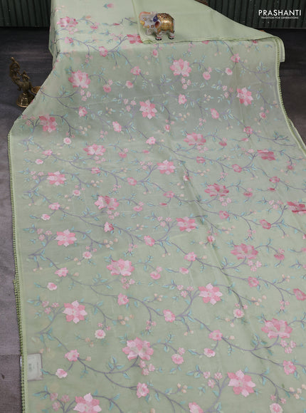 Organza saree pista green with floral embroidery work and crocia lace work border