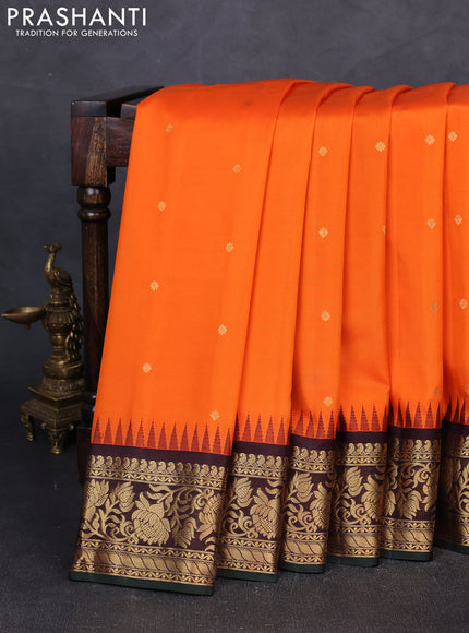 Pure gadwal silk saree orange and coffee brown with zari woven buttas and temple design zari woven border