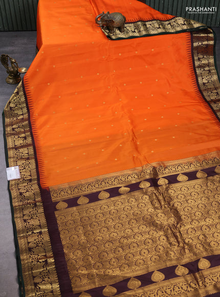 Pure gadwal silk saree orange and coffee brown with zari woven buttas and temple design zari woven border