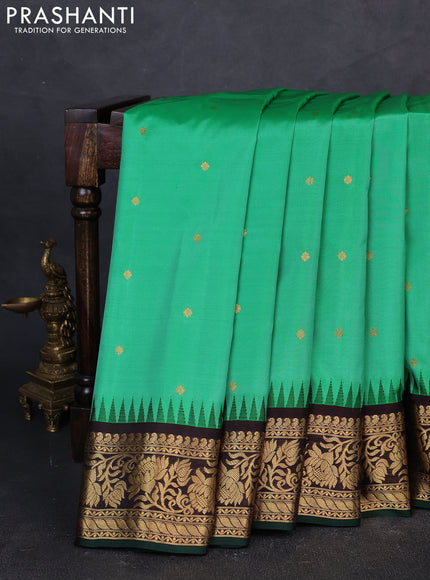Pure gadwal silk saree teal green and coffee brown with zari woven buttas and temple design zari woven border