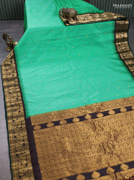 Pure gadwal silk saree teal green and coffee brown with zari woven buttas and temple design zari woven border