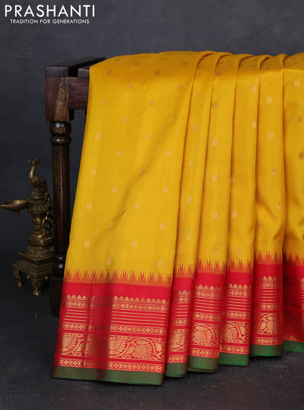 Pure gadwal silk saree yellow and red with allover zari wove buttas and temple design zari woven border