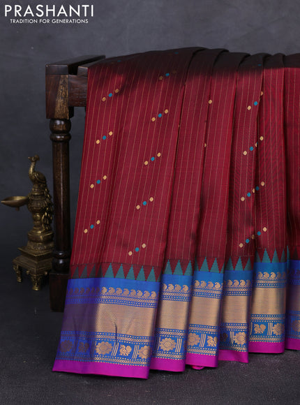 Pure gadwal silk saree deep maroon and dual tone teal greenish blue with allover zari stripe pattern & buttas and temple design zari woven border