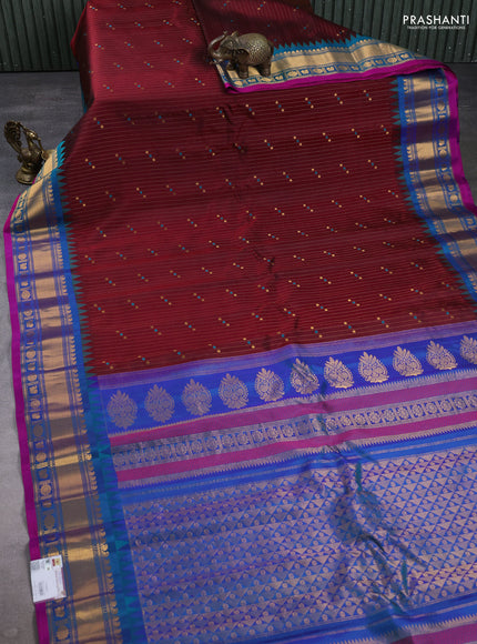 Pure gadwal silk saree deep maroon and dual tone teal greenish blue with allover zari stripe pattern & buttas and temple design zari woven border