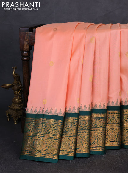 Pure gadwal silk saree peach and bottle green with zari woven buttas and temple design zari woven border