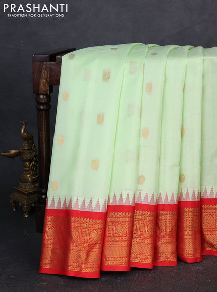 Pure gadwal silk saree pista green and orange with annam & rudhraksha zari woven buttas and temple design zari woven border