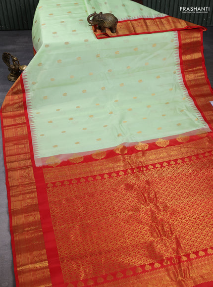 Pure gadwal silk saree pista green and orange with annam & rudhraksha zari woven buttas and temple design zari woven border