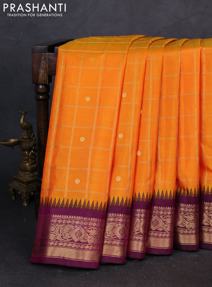 Pure gadwal silk saree mango yellow and purple with allover zari checks & buttas and temple design zari woven border