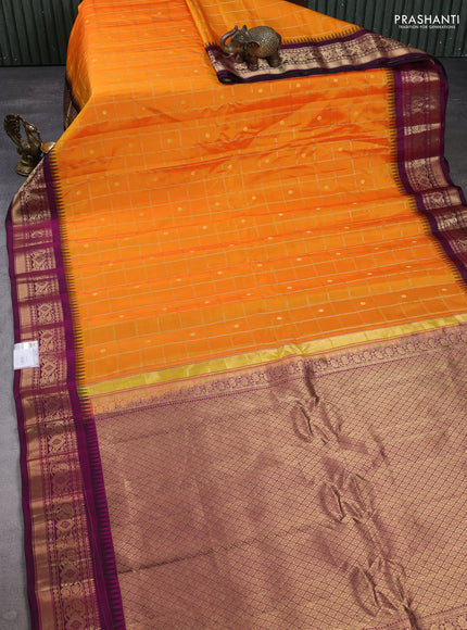 Pure gadwal silk saree mango yellow and purple with allover zari checks & buttas and temple design zari woven border