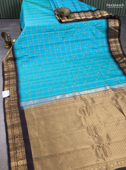 Pure gadwal silk saree teal blue and coffee brown with allover zari checks & buttas and temple design zari woven border