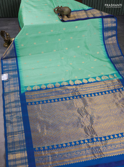 Pure gadwal silk saree mild teal green and cs blue with allover checks & zari buttas and temple design zari woven border