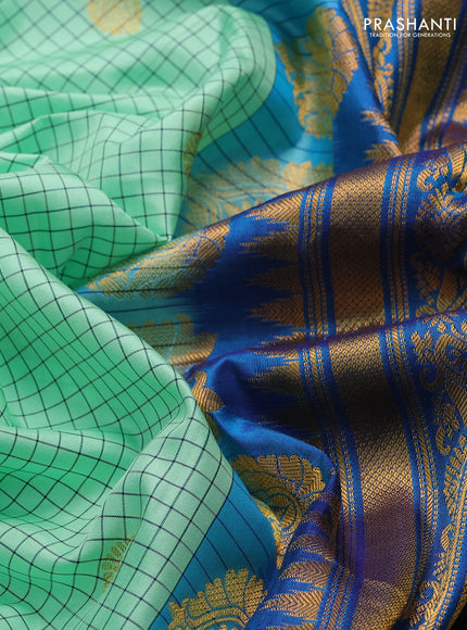 Pure gadwal silk saree mild teal green and cs blue with allover checks & zari buttas and temple design zari woven border