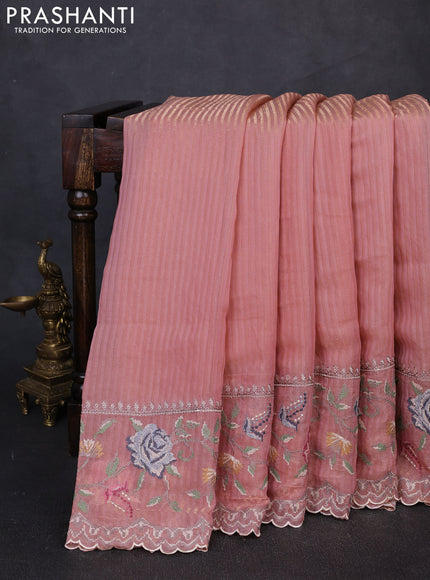 Organza saree peach with allover zari stripe pattern and floral convent embroidery border