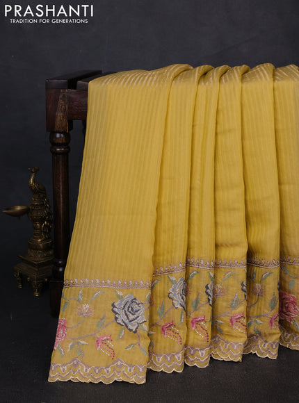 Organza saree yellow with allover zari stripe pattern and floral convent embroidery border