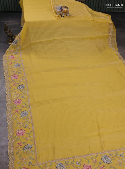 Organza saree yellow with allover zari stripe pattern and floral convent embroidery border