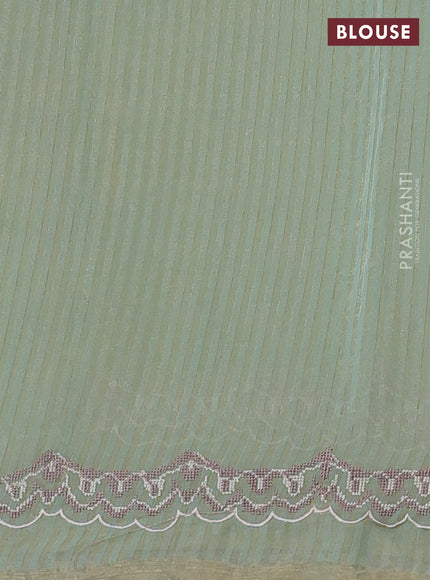 Organza saree pastel green with allover zari stripe pattern and floral convent embroidery border