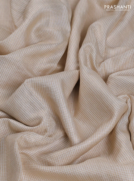 Pure tussar saree off white with allover small zari woven checked pattern and embroidery border