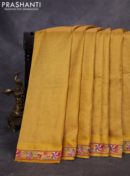 Pure tussar saree yellow with allover small zari woven checked pattern and embroidery border