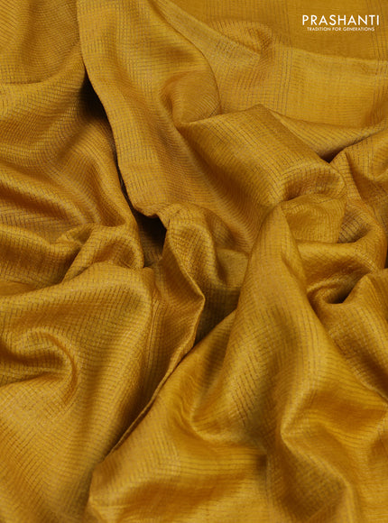 Pure tussar saree yellow with allover small zari woven checked pattern and embroidery border