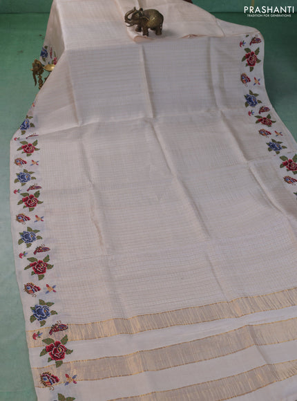 Pure tussar saree cream with allover zari checks & buttas and embroidery border