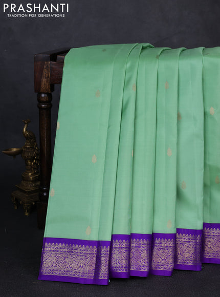 Pure kanchipuram silk saree pastel green and violet with zari woven buttas and zari woven korvai border