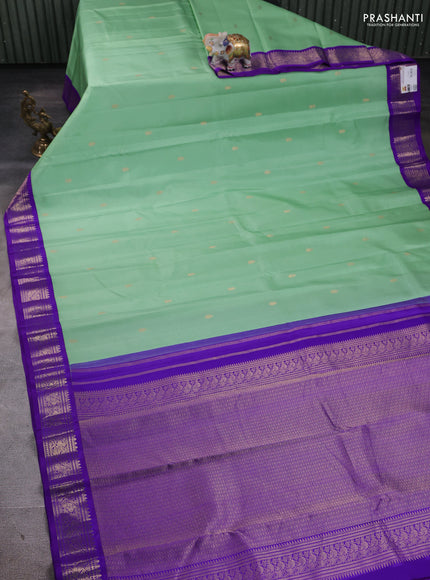 Pure kanchipuram silk saree pastel green and violet with zari woven buttas and zari woven korvai border