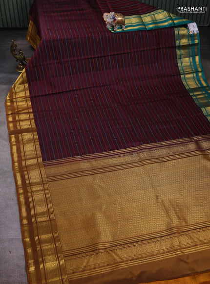 Pure kanchipuram silk saree deep maroon and dark mustard with allover thread stripes pattern and ganga jamuna border