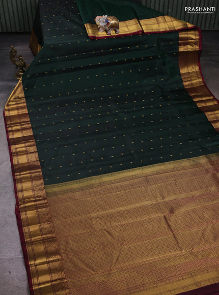 Pure kanchipuram silk saree dark green and maroon with zari woven buttas and zari woven border