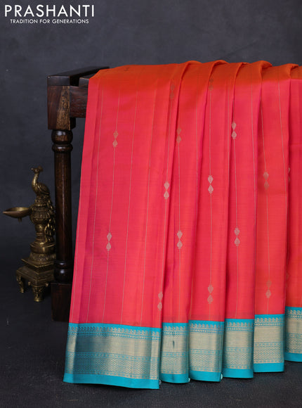 Pure kanchipuram silk saree peach orange and teal blue with allover zari weaves & buttas and zari woven korvai border