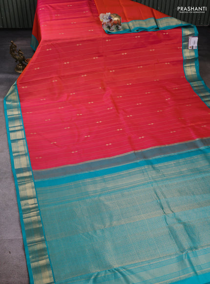 Pure kanchipuram silk saree peach orange and teal blue with allover zari weaves & buttas and zari woven korvai border