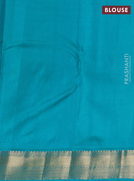 Pure kanchipuram silk saree peach orange and teal blue with allover zari weaves & buttas and zari woven korvai border