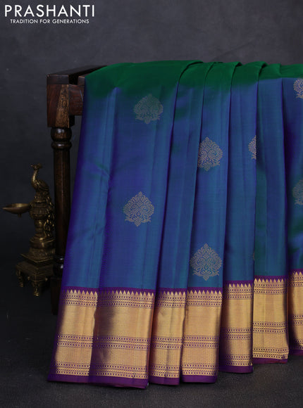 Pure kanchipuram silk saree dual shade of bluish green and purple with zari woven buttas and zari woven border