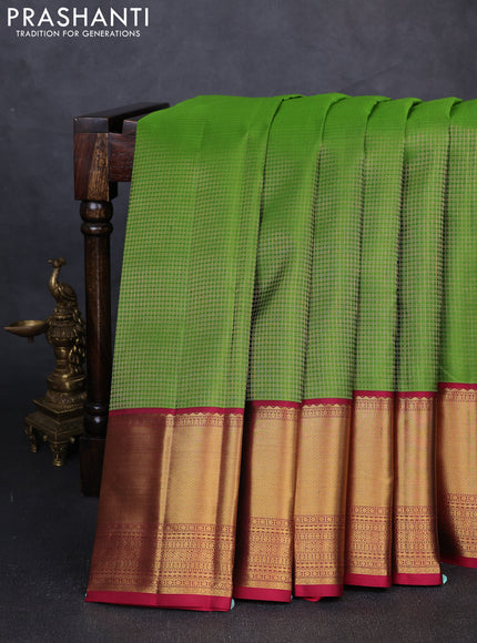 Pure kanchipuram silk saree parrot green and pink with allover small zari checked pattern and long zari woven border