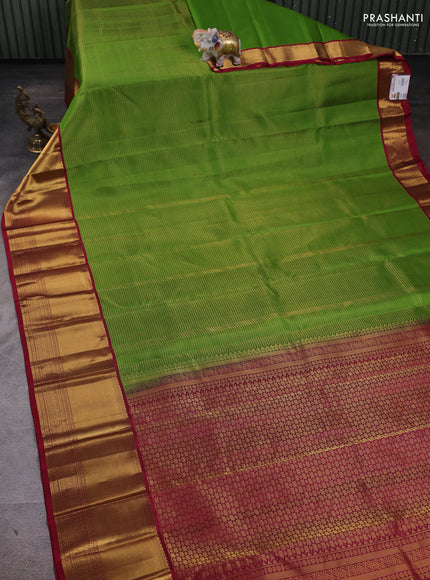 Pure kanchipuram silk saree parrot green and pink with allover small zari checked pattern and long zari woven border