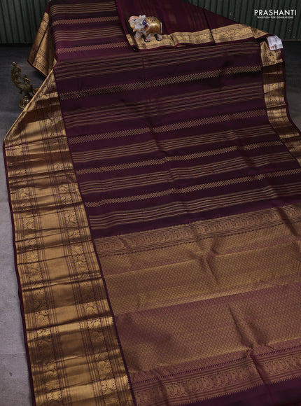 Pure kanchipuram silk saree wine shade with allover zari weaves and long zari woven border