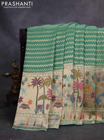 Art Georgette saree pastel green with allover zari weaves and zari woven paithani design border