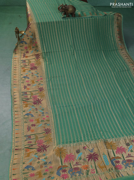 Art Georgette saree pastel green with allover zari weaves and zari woven paithani design border