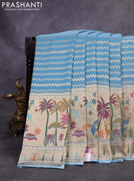Art Georgette saree pastel blue with allover zari weaves and zari woven paithani design border