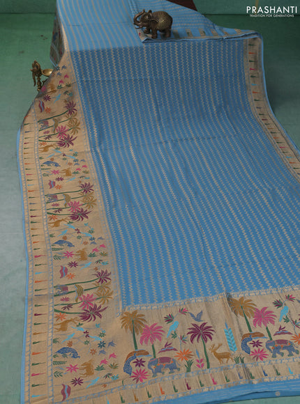 Art Georgette saree pastel blue with allover zari weaves and zari woven paithani design border