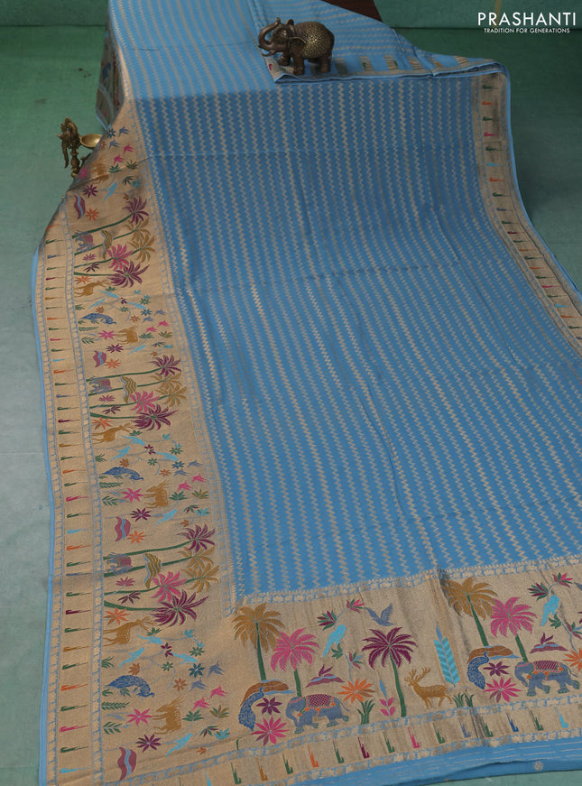 Art Georgette saree pastel blue with allover zari weaves and zari woven paithani design border