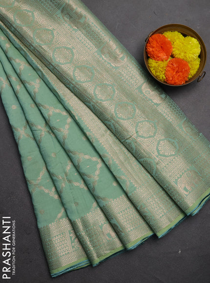 Semi chanderi saree pastel green with allover zari weaves and zari woven border