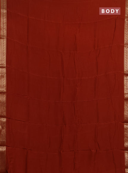 Semi mysore silk saree rust shade with plain body and zari woven border