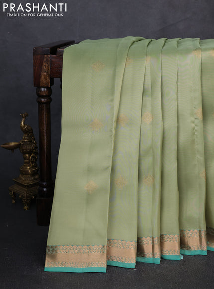 Kanchipuram silk saree pista green and teal green with zari woven buttas and zari woven border