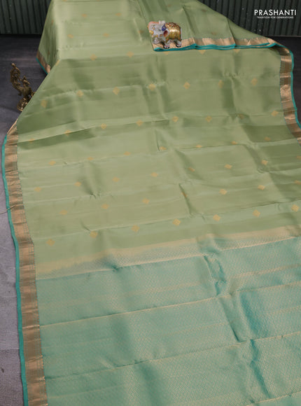 Kanchipuram silk saree pista green and teal green with zari woven buttas and zari woven border